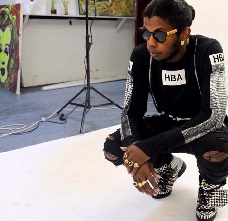 Fashion portrait of a crouching subject in a photography studio